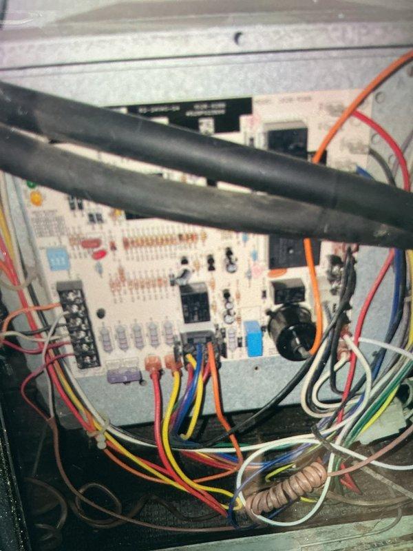 Completed routine maintenance on 10-year-old residential air conditioning system. Inspected outdoor condenser unit and indoor control board, verified all electrical connections and components are secure and functioning properly, and documented system condition with photographs for service records.