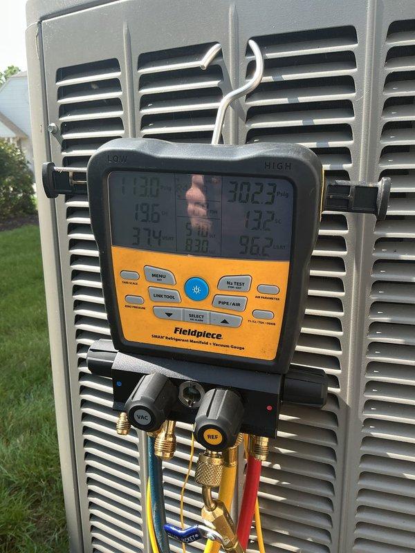 Completed preventive maintenance cooling visit on 21-year-old residential air conditioning system with outdoor condenser unit and basement air handler. Performed comprehensive system inspection including refrigerant pressure and temperature diagnostics using manifold gauges and digital testing equipment to verify proper operating pressures and superheat/subcooling values. Inspected outdoor condenser unit including coil condition, fan operation, electrical connections at disconnect box, and refrigerant line insulation integrity. All components found operating within normal parameters for system age, with no immediate service needs identified at this time.