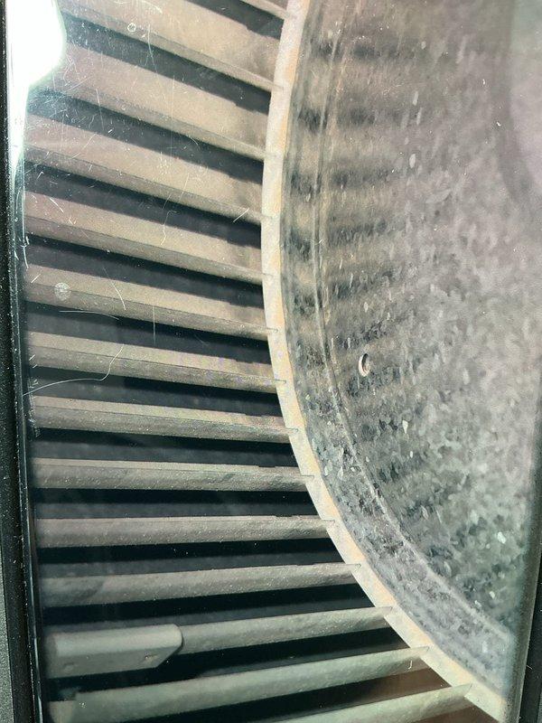 Completed scheduled maintenance on 5-year-old air conditioning system. Performed comprehensive inspection of refrigerant lines, blower assembly, and electrical connections. System components showed normal operational wear with dust accumulation on blower wheel and housing, which is typical for units at this service interval.