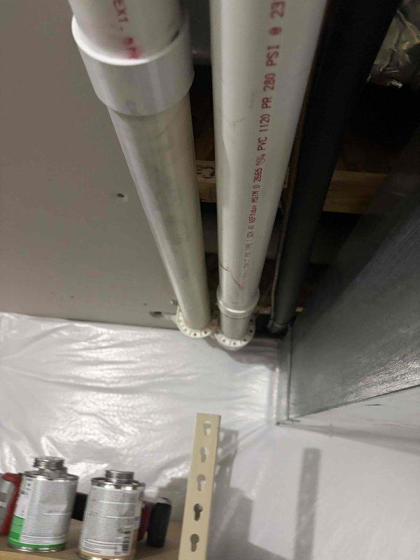 # HVAC Complete System Installation

Successfully completed installation of a high-efficiency 90% AFUE furnace and air conditioning system. Installed new furnace unit in mechanical room with proper clearances and mounting. Routed and secured white PVC intake and exhaust venting through ceiling cavity using manufacturer-approved materials and support methods. All PVC pipes properly secured with UV-resistant zip ties at appropriate intervals and supported with metal mounting brackets to prevent sagging and ensure code compliance.

Connected gas supply line using flexible corrugated tubing with proper shutoff valve installation. Installed and terminated all required electrical connections to unit, ensuring proper grounding and circuit protection. Configured condensate drainage system with appropriate trap installation and PVC piping to approved drain location.

Completed all refrigerant line connections between indoor and outdoor units with proper insulation and support. Pressure tested s