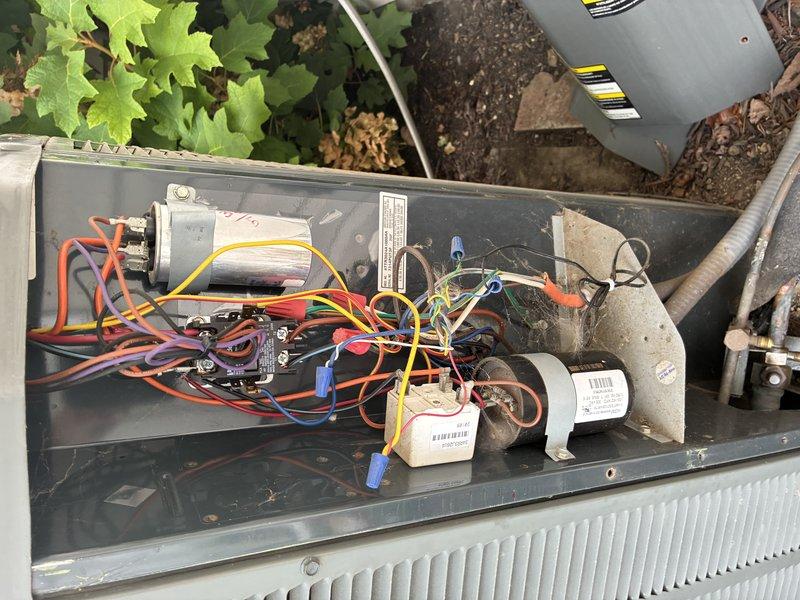 Completed MVP recurring cooling maintenance visit on residential outdoor air conditioning unit. Performed system inspection with access panel removed to examine electrical components, capacitor, contactors, and motor assembly. All wiring connections, wire nuts, and electrical components were checked and found secure with no visible defects. Unit exterior and surrounding area were inspected, confirming proper clearances maintained despite nearby landscaping. System is operating within normal parameters and ready for continued cooling season service.