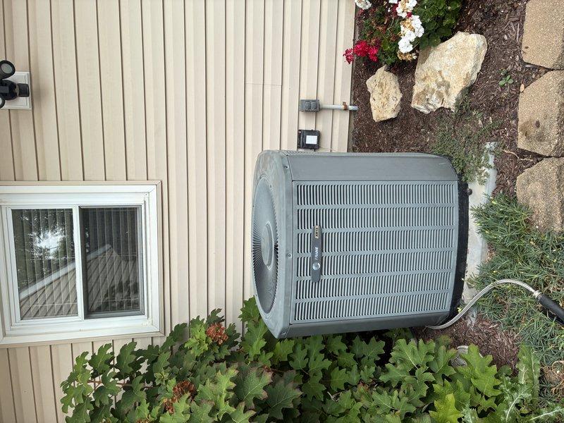 Completed MVP recurring cooling maintenance visit on residential outdoor air conditioning unit. Performed system inspection with access panel removed to examine electrical components, capacitor, contactors, and motor assembly. All wiring connections, wire nuts, and electrical components were checked and found secure with no visible defects. Unit exterior and surrounding area were inspected, confirming proper clearances maintained despite nearby landscaping. System is operating within normal parameters and ready for continued cooling season service.