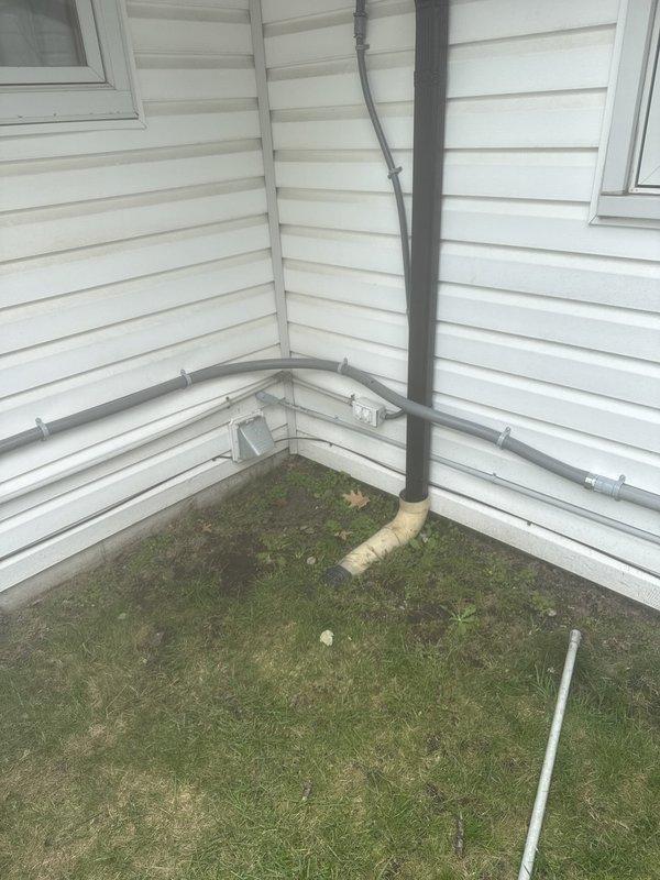 Replaced improperly installed dryer circuit that had romex wiring running outside the home. Installed new dedicated circuit with proper grounding and correctly insulated neutral conductor to supply dryer outlet, bringing installation up to current electrical code standards.