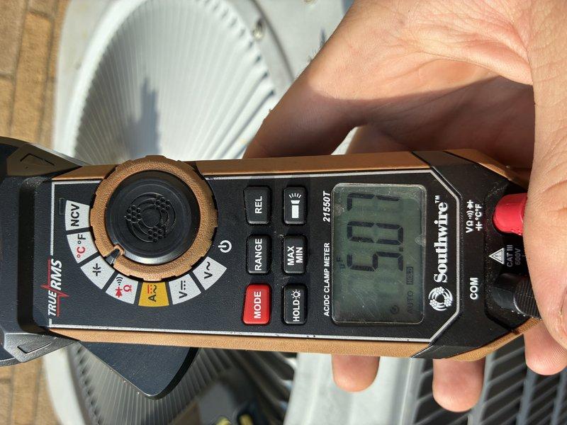 Performed routine AC tune-up on 5-year-old outdoor condensing unit. Conducted electrical diagnostics using clamp meter, verified system amperage readings, and inspected all mechanical components. Unit operating within normal parameters with no issues identified.