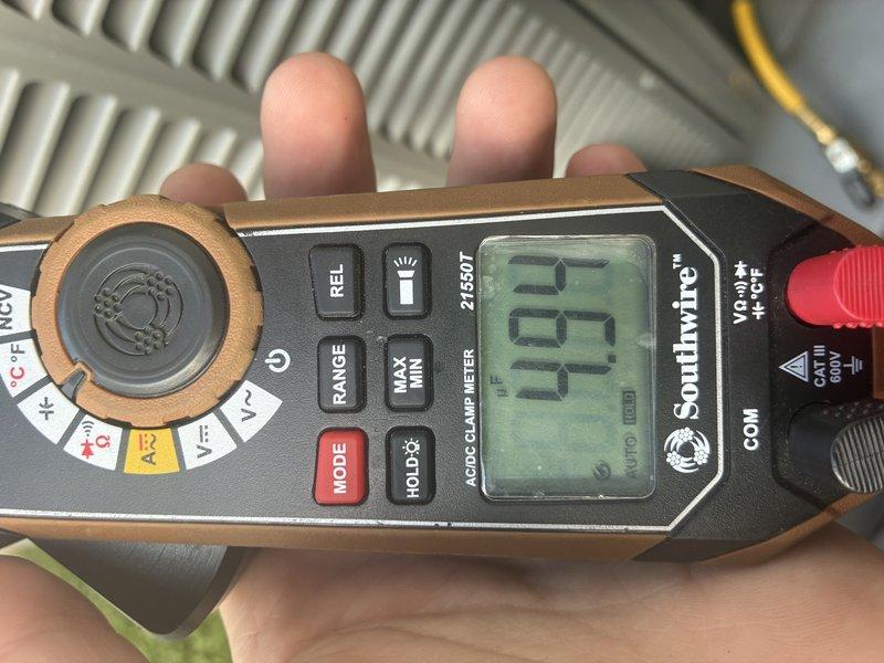 Completed scheduled MVP cooling maintenance visit. Inspected and verified air filter condition, finding pleated filter clean and functioning properly within air handler unit. Performed electrical diagnostics using digital multimeter, recording system readings at 0.9 on relevant circuits to confirm proper electrical operation of cooling system components.