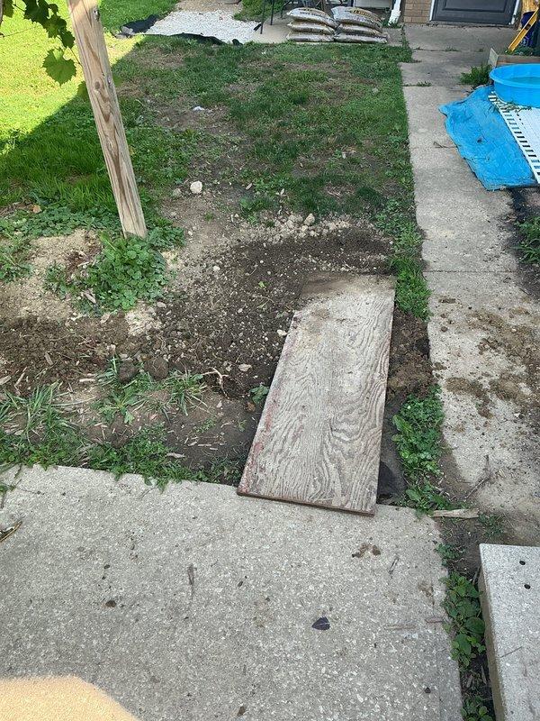 Completed post-inspection warranty work on underground electrical installation. Backfilled open trench and installed caution tape 12 inches above underground conductors per code requirements. Addressed customer inquiry regarding grounding rod placement near walking path and provided technical guidance on relocation feasibility while maintaining proper grounding system integrity.