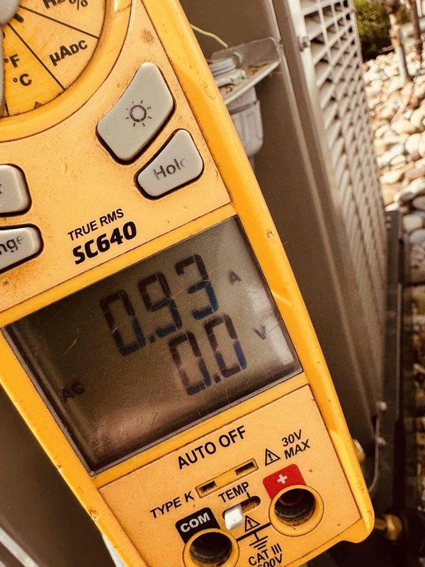 Completed MVP recurring cooling maintenance visit on residential HVAC system. Performed diagnostic testing using digital multimeter, recording amp draw reading of 560A and voltage measurement of 29.3V at outdoor condensing unit. All electrical parameters verified within normal operating range, and system confirmed operational with 0.0 secondary reading indicating proper functionality.