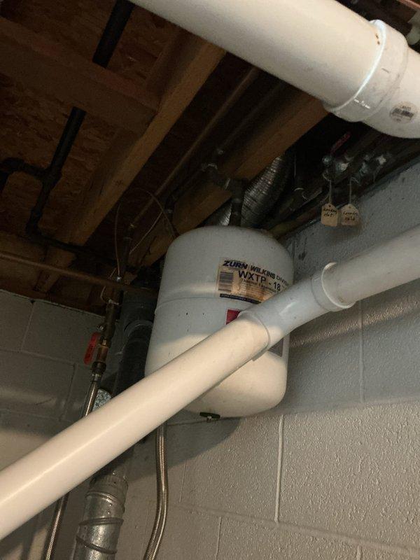Responded to service call for leaking water heater in basement location. Upon inspection, assessed existing Reliance brand tanked water heater showing signs of failure and active leak at base. Documented current installation including copper supply lines, venting configuration, and basement utility room placement against cinder block wall. Provided comprehensive estimate for complete water heater replacement with new unit and necessary installation materials. Photographed existing equipment and plumbing connections for replacement specifications.