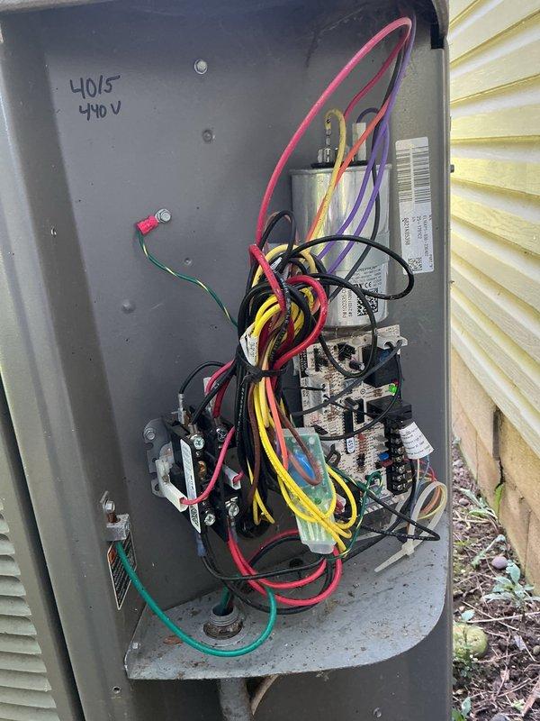 Completed routine MVP cooling maintenance visit on residential air conditioning system. Performed comprehensive inspection of outdoor condenser unit and associated electrical disconnect panel, documenting equipment condition with photographs. Verified proper operation of contactors, relays, and electrical connections within the 440V disconnect box, noting capacitor specifications of 40/5 MFD. All system components found operating within normal parameters with no immediate service needs identified.