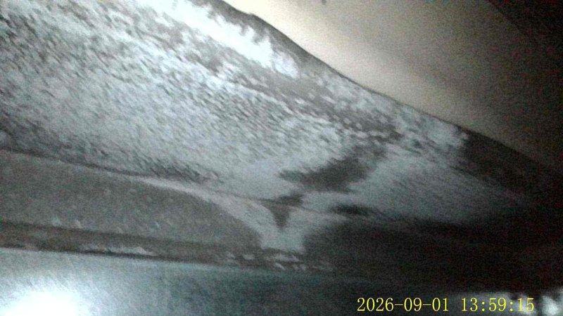 Responded to callback for recurring water leak around furnace area originating from above unit. Previous service included refrigerant and sealant application, but issue persisted upon system operation. Inspected 16-year-old central air conditioning system and documented conditions. Found extensive dust and debris accumulation on evaporator coil and ductwork components. Identified clogged condensate drain line as primary cause of water overflow. Cleared blockage from drain line, cleaned condensate pan, and verified proper drainage flow. Recommended routine maintenance including coil cleaning and filter replacement to prevent future occurrences.