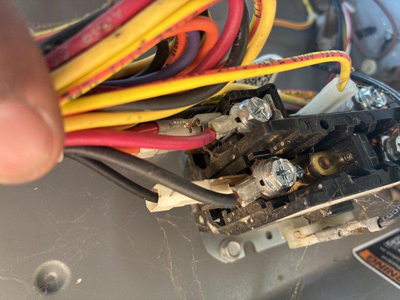 Completed seasonal AC tune-up inspection on residential cooling system. Performed comprehensive evaluation of electrical connections, contactors, and control wiring, documenting existing conditions including aged wiring with visible discoloration, rust staining on metal components, and dust accumulation throughout the unit. All electrical terminals and connections were inspected for proper tightness and functionality to ensure safe system operation for the cooling season.