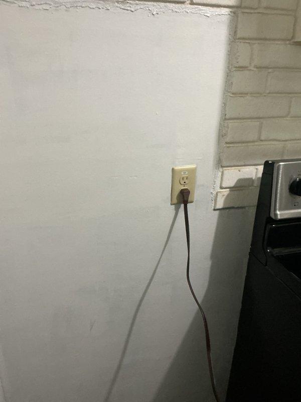 Replaced outdated two-prong electrical outlet with grounded three-prong receptacle in kitchen area to meet current safety standards. Verified proper grounding and secure installation in existing electrical box, restoring safe electrical service to the location.