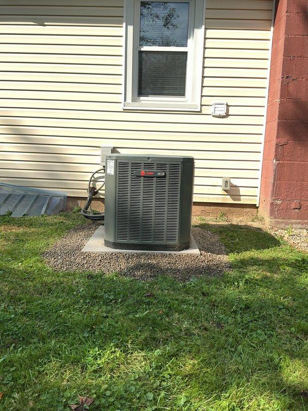Leveled outdoor air conditioning condenser unit using gravel and hand jack equipment. The concrete pad supporting the unit was adjusted to ensure proper positioning and stability. Gravel material was utilized to provide adequate drainage and support beneath the equipment, restoring the installation to manufacturer specifications.