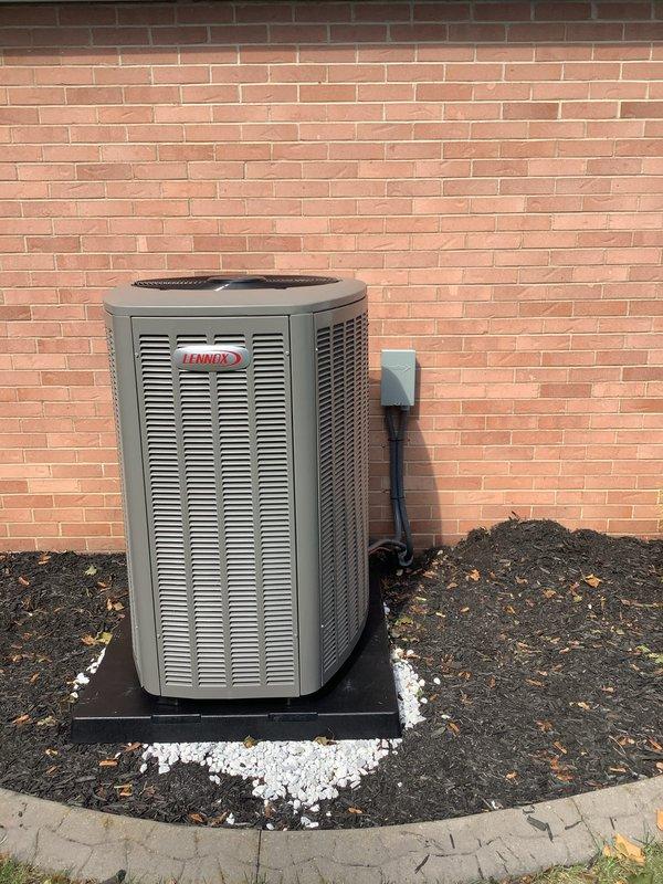 Completed full HVAC system installation including a new Lennox 90% efficiency furnace in the basement mechanical room and matching outdoor condensing unit. The indoor air handler was positioned with proper condensate drainage via PVC piping and refrigerant lines, integrated with existing ductwork. The outdoor Lennox condenser was mounted on a composite pad with gravel base, connected to wall-mounted electrical disconnect, and properly leveled for optimal operation.