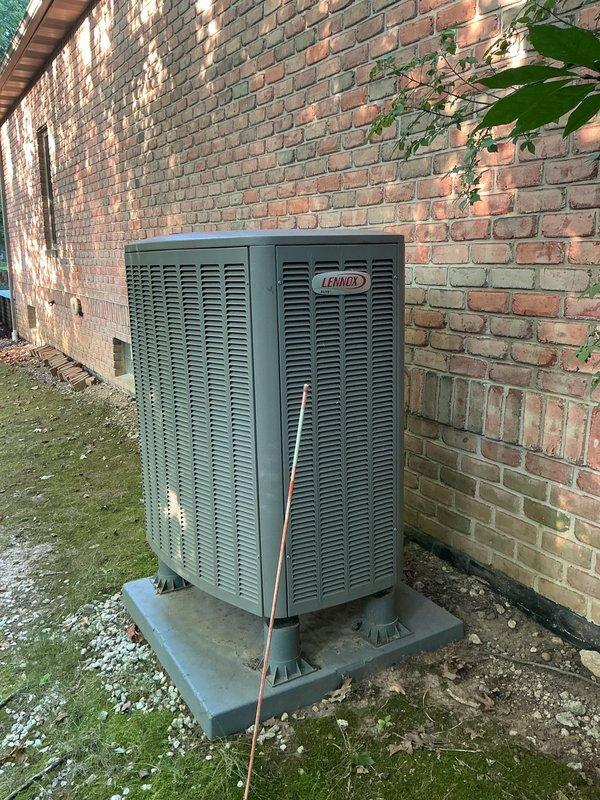 Completed scheduled MVP cooling maintenance visit on Lennox outdoor condensing unit and indoor air handling system. Performed comprehensive system inspection including visual assessment of outdoor unit positioned on concrete pad against building exterior, verified proper clearances and drainage through white PVC condensate line, and inspected indoor furnace/air handler with associated ductwork and electrical connections. All components operating within normal parameters with no immediate service needs identified. System ready for continued cooling season operation.