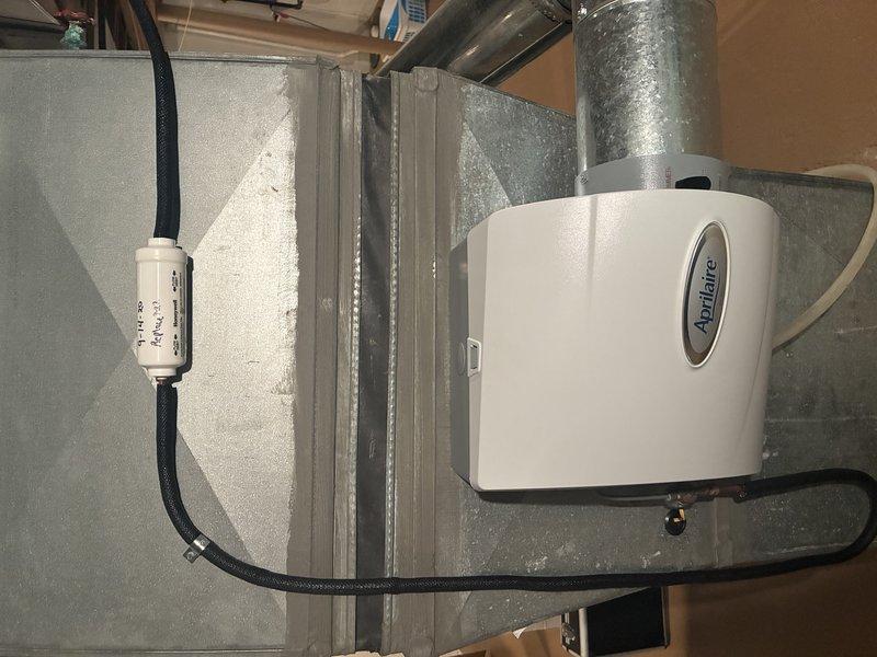 Completed heating maintenance visit on 10-year-old gas furnace system. Inspected and serviced heating equipment including furnace unit, Aprilaire humidifier mounted on ductwork, and ventilation components. All systems operating properly with no issues found during inspection.
