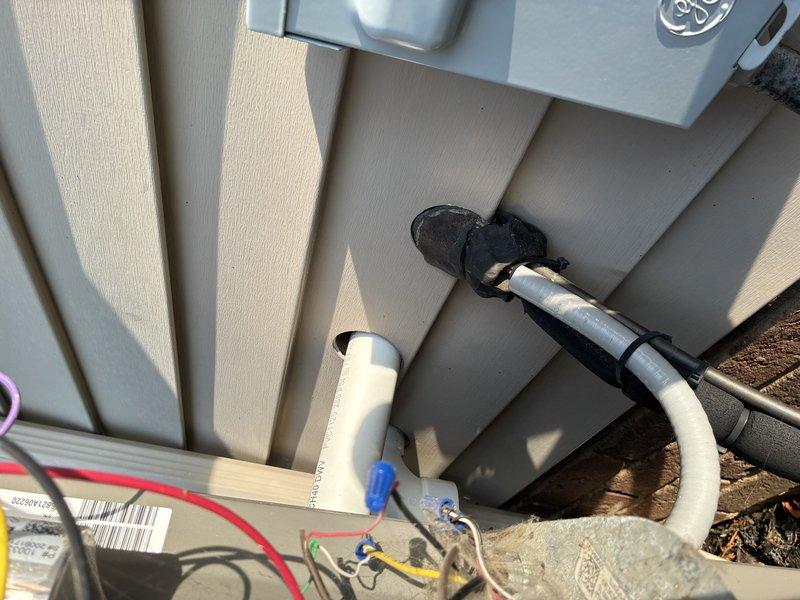 Completed comprehensive AC tune-up including inspection of indoor air handler electrical components, capacitor, and motor assembly. Verified outdoor disconnect box operation, tested electrical connections, and inspected refrigerant line set and condensate drainage system for proper function.