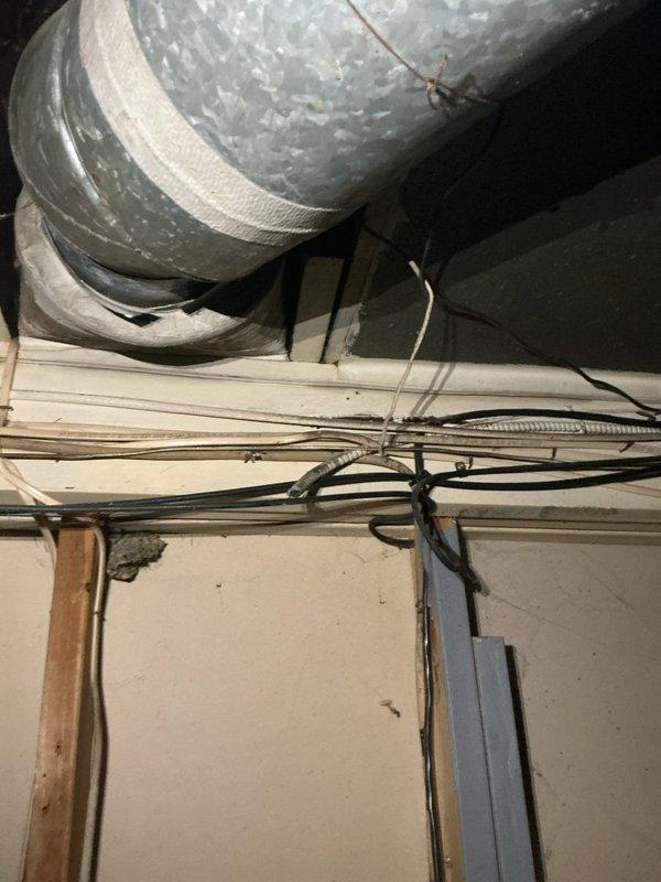 Completed comprehensive electrical safety upgrades including securing exposed wiring in basement and attic spaces with proper cable management and protective covering. Repaired grounding issues at existing outlets, replaced damaged two-prong outlets with properly grounded three-prong receptacles to meet current electrical code standards, and installed battery-operated smoke and carbon monoxide detectors throughout the residence to enhance occupant safety.