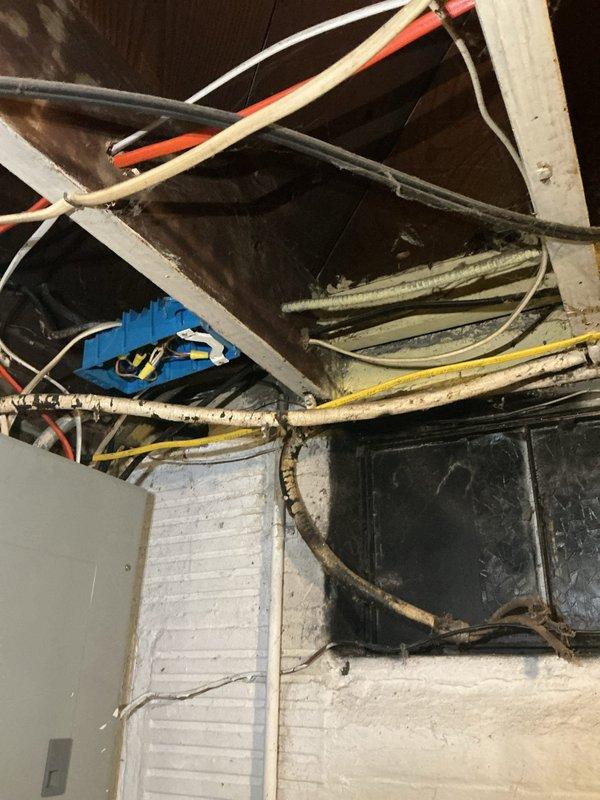 Completed comprehensive electrical safety upgrades including securing exposed wiring in basement and attic spaces with proper cable management and protective covering. Repaired grounding issues at existing outlets, replaced damaged two-prong outlets with properly grounded three-prong receptacles to meet current electrical code standards, and installed battery-operated smoke and carbon monoxide detectors throughout the residence to enhance occupant safety.