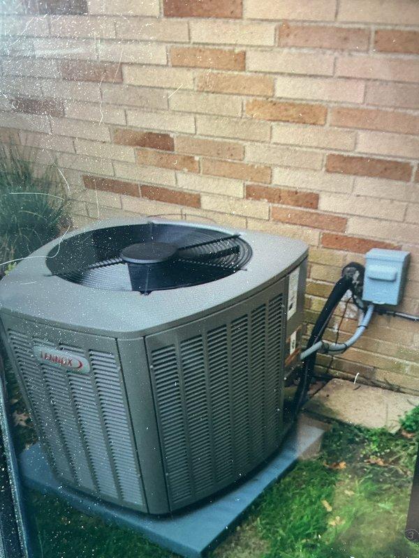 Completed MVP cooling maintenance visit on residential Lennox condenser unit. Performed standard system inspection, documented equipment condition with exterior unit showing normal operation with refrigerant lines and electrical connections intact. Observed debris accumulation in window track area near equipment location requiring attention for proper airflow maintenance.