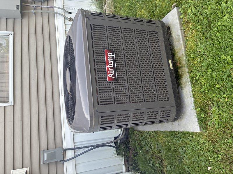 Completed MVP AC maintenance on Amana condensing unit. Performed comprehensive system inspection including electrical measurements using digital clamp meter to verify proper amperage draw and component operation. Inspected condenser coil, fan assembly, and electrical connections. Unit operating within normal parameters with all components functioning properly.