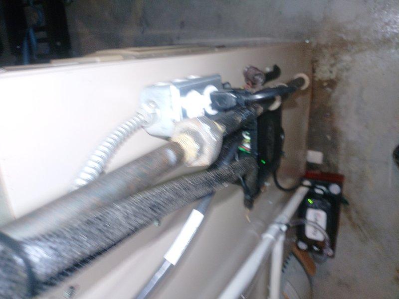 Responded to service call for water pooling in basement during air conditioner operation on a one-year-old Lennox system. Upon arrival, performed visual inspection of the indoor HVAC unit and surrounding area, documenting conditions with photographs. Identified water staining and moisture damage on basement concrete floor and walls near the equipment location. Inspected condensate drain line system, evaporator coil assembly, and drain pan for proper operation and potential blockages. Examined the insulated refrigerant lines, electrical components, and mounted contactors for any signs of condensation or refrigerant leaks that could contribute to water accumulation. Verified condensate pump operation if equipped, checked drain line routing and termination point, and ensured proper pitch for gravity drainage. Cleared any debris or biological growth from condensate system components and confirmed water flow through drain line during operation.
