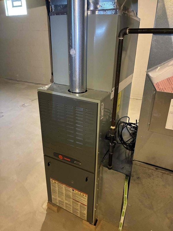 Completed comprehensive AC tune-up for new homeowner with unknown service history on Trane system. Performed full inspection of evaporator coil assembly, verified refrigerant line connections showing minor surface oxidation but structurally sound, and tested brass valve assembly with condensate management system for proper operation. All components found to be in functional condition with normal operational wear; system operating within manufacturer specifications with no immediate service needs identified.