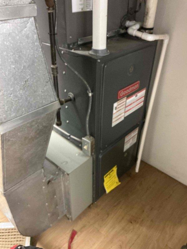 Completed MVP air conditioning maintenance service on Goodman HVAC system. Inspected furnace unit and associated components, replaced dirty air filter showing significant dust and debris accumulation with clean filter to restore proper airflow and system efficiency. Verified all mechanical and electrical connections, PVC condensate drainage, and venting components are secure and functioning properly.