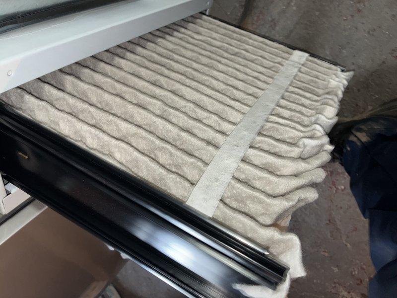 Responded to service call for 9-year-old air conditioning system producing excessive noise described as lawnmower-like sound. Performed diagnostic inspection of unit while system was operational and cooling properly. Inspected air filter and found moderate dust accumulation in pleated media. Measured supply air temperature at ductwork, recording 60.5°F, confirming adequate cooling performance. Advised customer that system is functioning within normal parameters for cooling capacity, and noise may be related to normal operational sounds from aging compressor or condenser fan motor, though no immediate mechanical failures were detected during visual inspection.