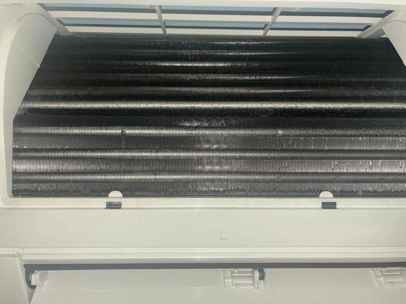 Performed preventative maintenance on multi-zone mini split system consisting of three outdoor condensing units and four indoor air handlers located in kitchen and three bedrooms. Cleaned and inspected evaporator coils, filters, and drain pans on all four operational heads, removing accumulated dust and debris from heat exchanger fins to restore optimal airflow and system efficiency. Two additional heads from recently installed system were excluded from service per customer request.
