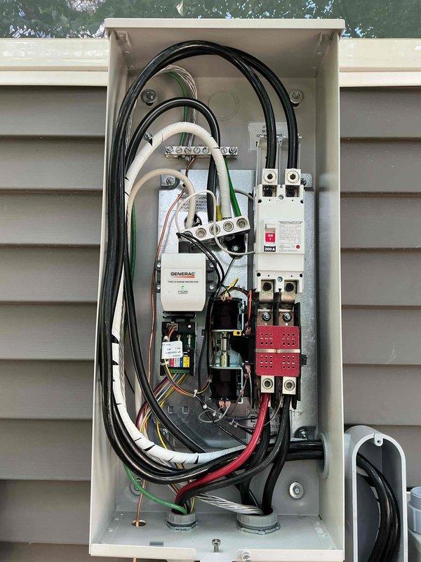 Completed installation of 24 KW residential standby generator with 200 amp automatic transfer switch. Ran approximately 40 feet of electrical conduit and wiring from the main service panel to the generator location, along with 10 feet of natural gas line to fuel supply. Installed and wired transfer switch to isolate essential circuits during utility power outages, with all connections properly terminated and secured per manufacturer specifications and local electrical code requirements.
