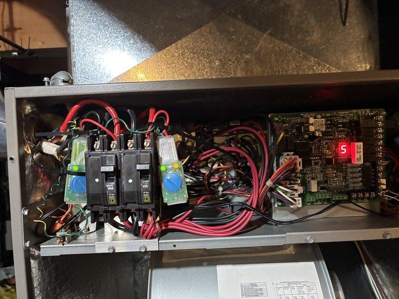 Completed scheduled preventive maintenance visit on 8-year-old air conditioning system for MVP customer. Performed comprehensive inspection of electrical control panel, verifying proper operation of circuit breakers, surge protection components, and control board functionality. Inspected refrigerant lines, noting existing copper oxidation and brass valve condition consistent with system age, and examined condensate drain pan area for proper drainage and cleanliness.