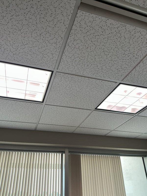 Responded to service call for ceiling light replacement in office space. Removed existing fluorescent light fixtures from suspended acoustic tile ceiling system and installed new LED recessed light fixtures with white trim. Verified proper electrical connections, tested illumination levels, and ensured all ceiling tiles were properly reinstalled in grid system. All lighting fixtures now operational and functioning correctly.