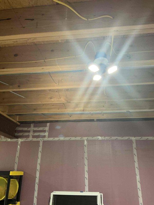 Conducted on-site electrical estimate for Kohler generator installation. Evaluated existing gas meter infrastructure and electrical service requirements, documenting current utility connections including gas line routing with PVC and copper piping configurations. Assessed interior space showing active construction phase with exposed ceiling joists and unfinished wall sections to determine optimal generator placement and electrical integration points for the installation.