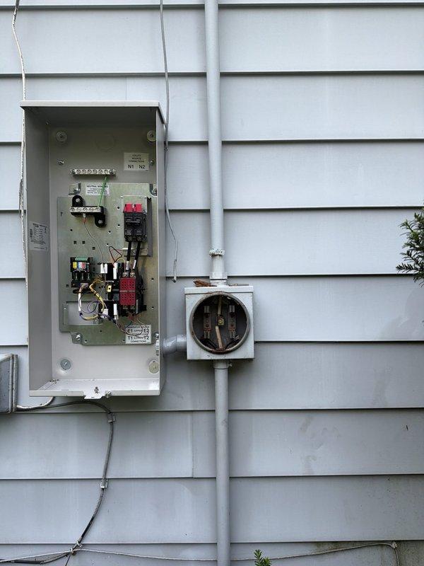 Completed installation of Generac 22kW standby generator system with 100-amp automatic transfer switch. Ran approximately 30 feet of electrical conduit and wiring from main service panel to generator location, installed new gas line piping from existing meter to generator unit, and mounted transfer switch adjacent to electric meter on exterior wall. System tested and operational upon completion, with all electrical connections properly terminated and gas supply verified for safe generator operation.