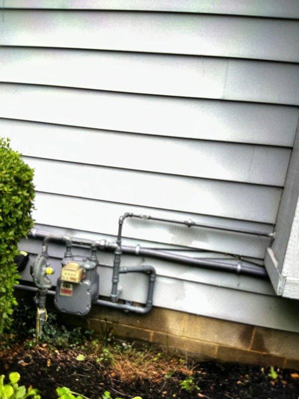 Completed installation of Generac 22kW standby generator system with 100-amp automatic transfer switch. Ran approximately 30 feet of electrical conduit and wiring from main service panel to generator location, installed new gas line piping from existing meter to generator unit, and mounted transfer switch adjacent to electric meter on exterior wall. System tested and operational upon completion, with all electrical connections properly terminated and gas supply verified for safe generator operation.