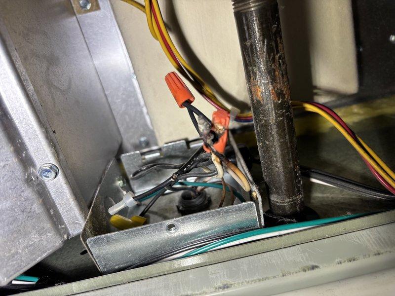 # HVAC Service Report

Responded to no cooling complaint on 2-year-old air conditioning system. Performed diagnostic inspection of indoor air handler unit. Removed access panel and inspected internal components including control boards, wiring connections, and electrical systems. Examined circuit boards, wire bundles, and connection points for signs of failure or malfunction. Inspected condensate drain piping and mechanical components within the unit. All findings documented with photographs for service records.
