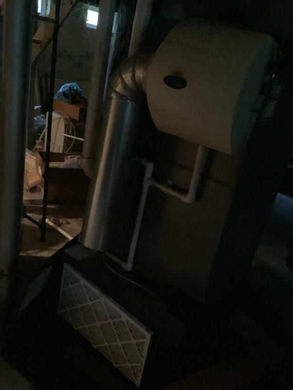 Performed comprehensive assessment of 21-year-old HVAC system experiencing complete heating and cooling failure. Evaluated furnace and air conditioning equipment located in basement utility area, documenting existing installation configuration including ductwork connections, filtration system, and overall equipment condition. Provided detailed replacement estimate for complete system upgrade due to age-related equipment failure and inability to restore heating and cooling functionality.