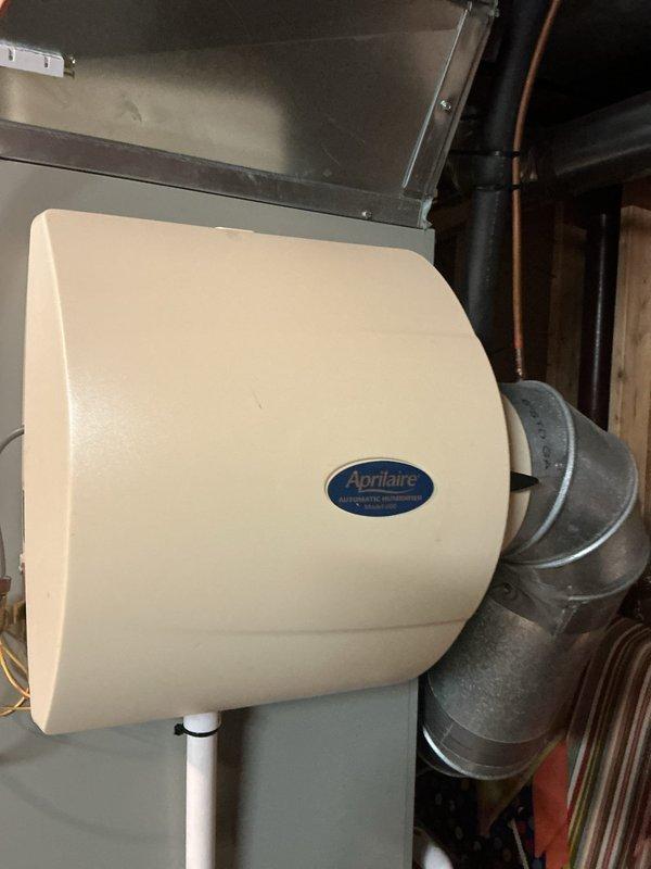 Responded to UV light service indicator alert on thermostat for recently installed Air Scrubber system. Inspected both Air Scrubber units installed in June 2025, verified proper operation of UV-C lamps, and reset service indicator. Confirmed humidifier and overall HVAC system functioning properly with 9-year-old air conditioning unit showing normal operating conditions.