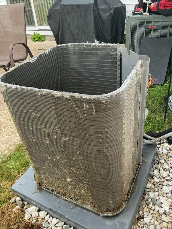 Completed MVP recurring cooling maintenance visit on residential HVAC system. Performed comprehensive inspection of indoor air handler unit located in utility closet, including Lennox filtration system, ductwork connections, and refrigerant lines. Exterior condenser unit showed significant accumulation of dirt, dust, and debris on coil fins and casing, which was addressed during service to restore proper airflow and system efficiency. All components inspected and system operational upon completion.