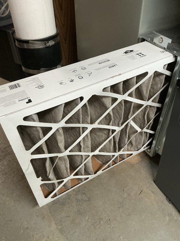 Performed preventive maintenance service on 14-year-old residential air conditioning system for MVP customer. Replaced air filters at indoor air handler unit, installing new pleated filters with proper airflow direction. Inspected outdoor condensing unit, noting visible corrosion on internal components and aging capacitor marked with service dates. Confirmed unit operational status and verified all electrical connections secure despite age-related weathering of components.