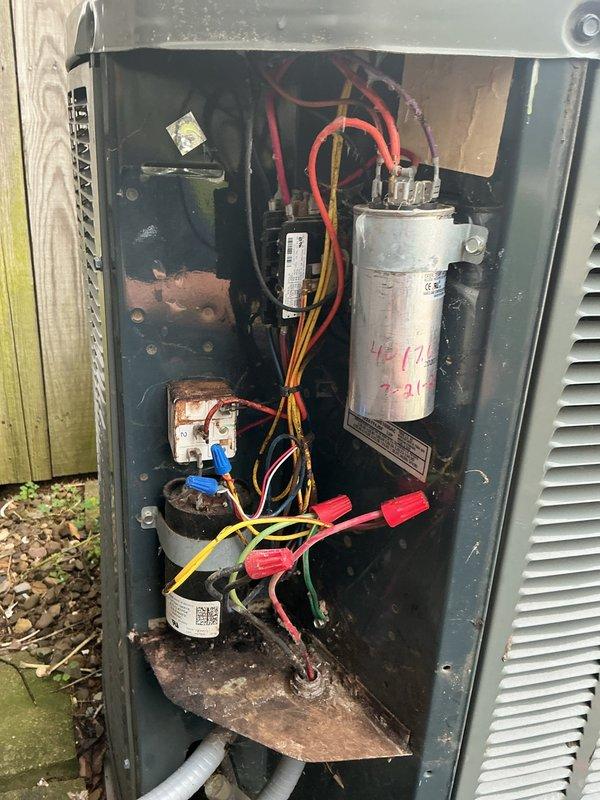 Performed preventive maintenance service on 14-year-old residential air conditioning system for MVP customer. Replaced air filters at indoor air handler unit, installing new pleated filters with proper airflow direction. Inspected outdoor condensing unit, noting visible corrosion on internal components and aging capacitor marked with service dates. Confirmed unit operational status and verified all electrical connections secure despite age-related weathering of components.