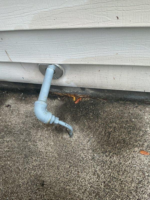 Responded to gas leak on exterior gas line. Located leak at threaded connection point on galvanized pipe assembly mounted to building exterior. Applied leak detection solution to confirm active leak at joint. Tightened and re-sealed threaded fitting to eliminate gas escape. Performed pressure test to verify repair integrity and confirm no additional leaks present in exposed piping. Additionally secured loose toilet inside residence by tightening closet bolts and reseating fixture to floor flange.