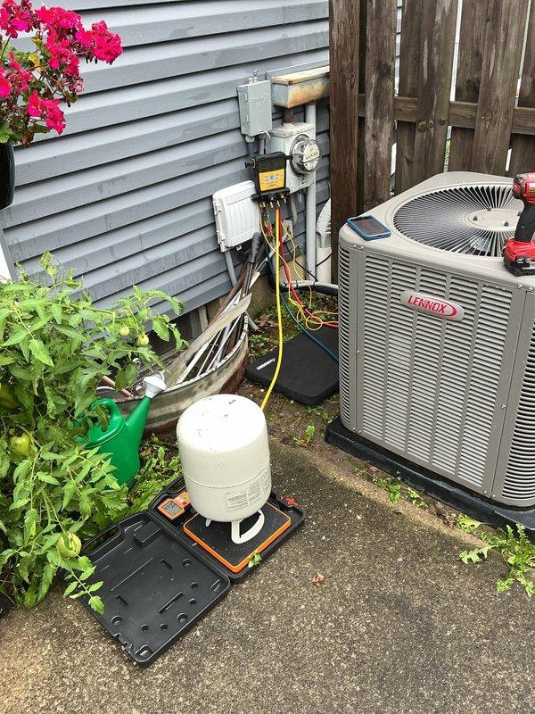 Responded to service call for excessive basement moisture following recent AC installation. Inspected Lennox air conditioning system and indoor furnace unit for potential water leaks or condensate drainage issues. Examined condensate drain lines, PVC piping connections, and drainage system routing to identify source of moisture accumulation. Verified proper condensate pump operation and checked for any blockages in drain lines. Inspected evaporator coil drain pan for cracks or overflow conditions. Assessed outdoor condenser unit placement and surrounding area for proper drainage away from foundation. No active water leaks observed on floor during inspection, but confirmed significant dehumidifier usage indicating elevated humidity levels. Evaluated condensate management system integrity and provided recommendations to address moisture concerns related to HVAC operation.