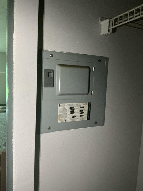 Completed comprehensive electrical inspection of vacant property as requested by power company. Inspected main electrical panel, meter center with multiple utility meters, and verified all electrical systems were properly installed and functioning. All components found to be in normal working condition with utility seals intact and ready for service activation.
