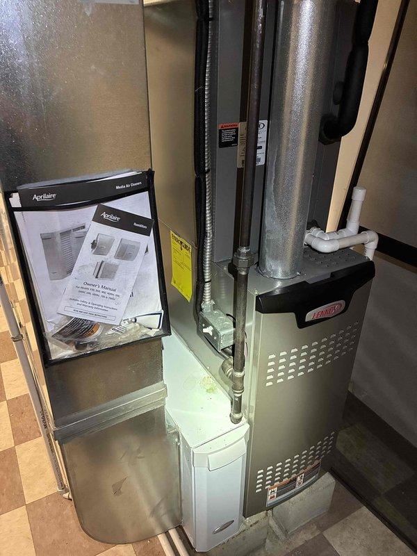 Completed MVP AC maintenance on residential Lennox cooling system. Performed comprehensive inspection of furnace unit, Aprilaire humidifier, and associated ductwork connections. Verified system operation and documented supply air temperature reading of 51.5°F, confirming proper cooling performance and refrigerant charge levels within manufacturer specifications.