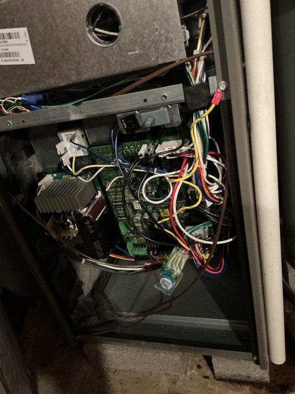 Completed installation of surge protection device on HVAC system. Accessed furnace control panel and outdoor condensing unit to integrate surge protector with existing electrical components and control boards. Verified proper wiring connections, tested system operation, and confirmed all components functioning correctly with surge protection now in place.