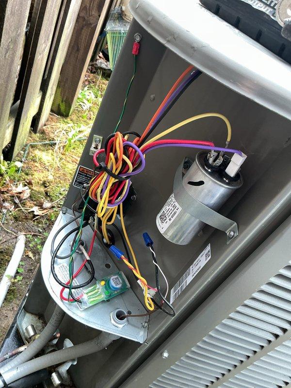 Completed installation of surge protection device on HVAC system. Accessed furnace control panel and outdoor condensing unit to integrate surge protector with existing electrical components and control boards. Verified proper wiring connections, tested system operation, and confirmed all components functioning correctly with surge protection now in place.
