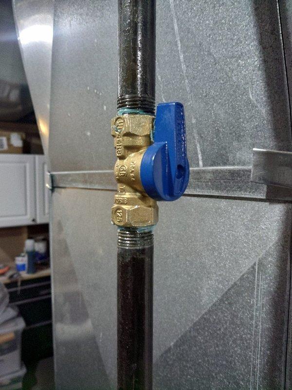 Completed installation of 90% AFUE gas furnace as first-time setup. Installed new gas supply line with brass ball valve featuring quarter-turn shutoff for safe fuel control to unit. Established proper electrical connections within junction box, terminating all power and control wiring with appropriate wire nuts and protective loom conduit. Verified all gas connections for leak-free operation and confirmed electrical components are properly grounded and secured within furnace cabinet. System tested and operational.