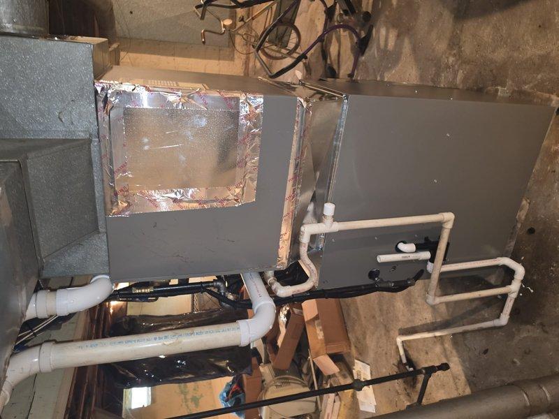 Completed initial phase of furnace installation at approximately 90% completion. Installed new air handler unit with proper ductwork connections, PVC condensate drain lines, and flexible metal conduit for electrical connections. Secured all piping with appropriate mounting straps and clamps, routed white PVC ventilation pipes through attic space with 90-degree elbow fittings, and established junction box connections for electrical components. Compiled comprehensive material list for return visit to complete final connections, testing, and system commissioning scheduled for the following week.